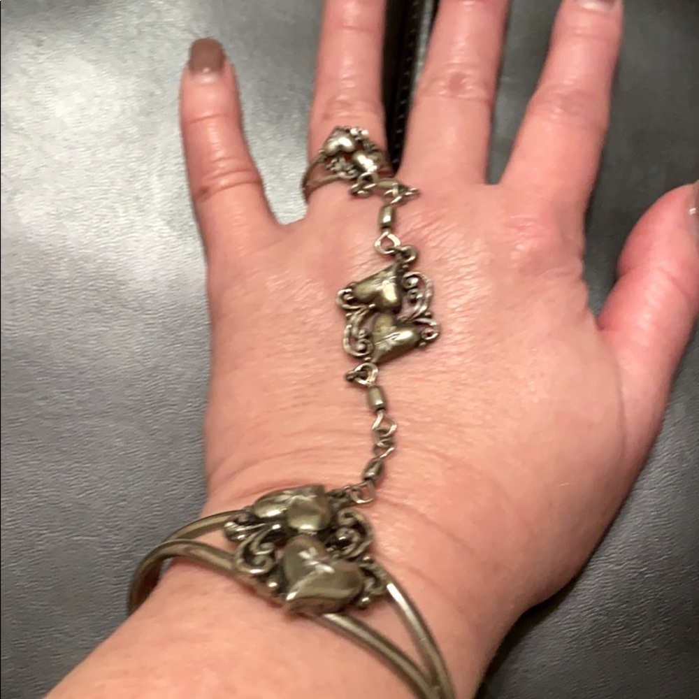 Silver tone, bracelet and ring attached